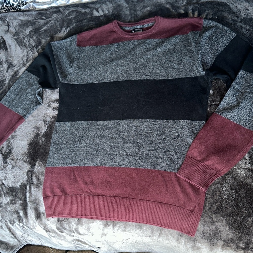 Maroon,black,and gray sweater.Well kept.Great for dressing up during the fall